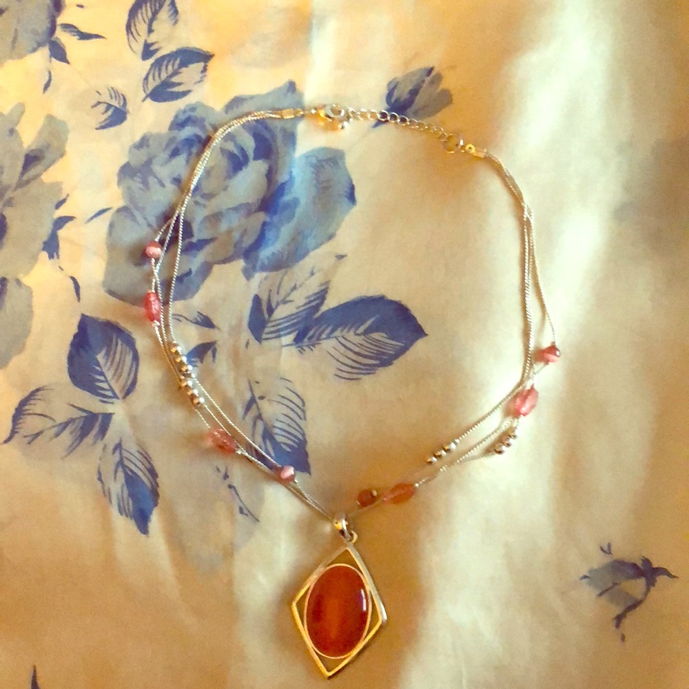 Stunning pink cat’s eye necklace.